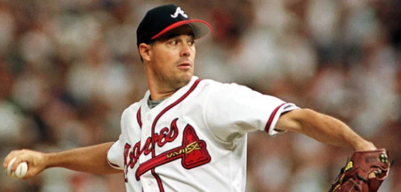 Greg Maddux delivering a pitch in an Atlanta Braves uniform